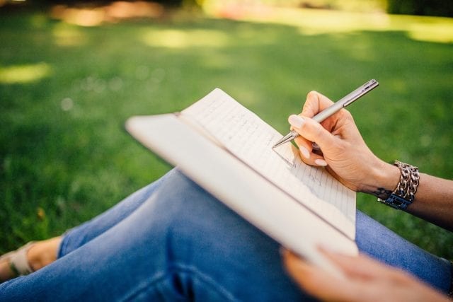 Notebook on lap outside